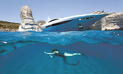 Adventure on the sea - Diving under a luxury yacht